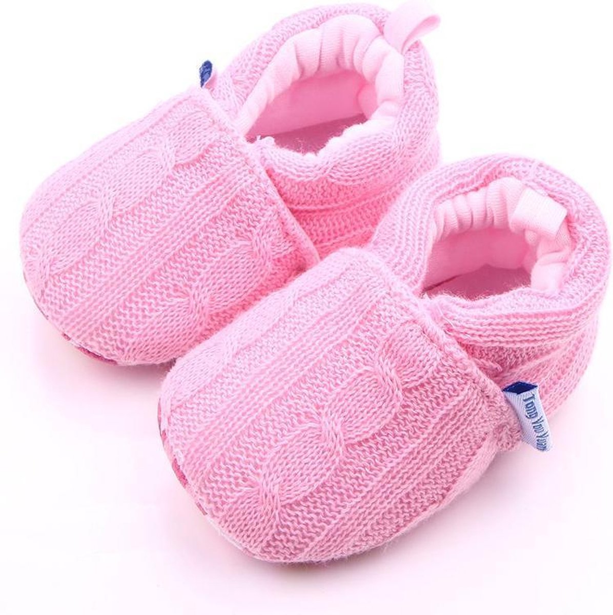 Roze gebreide babyslofjes